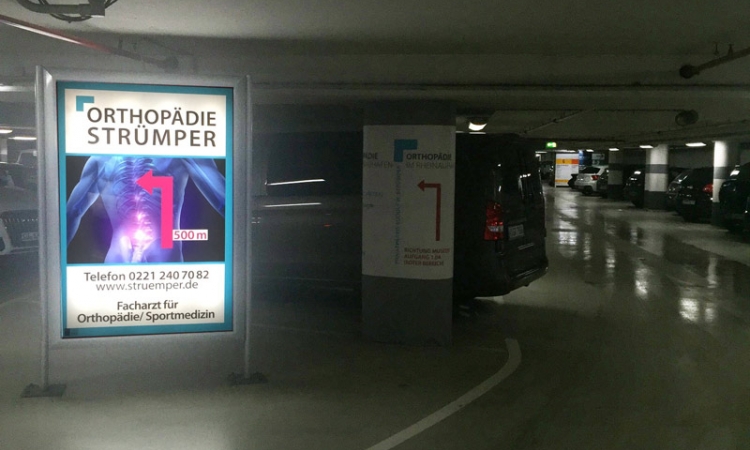 You will see our sign immediately after entering the parking garage. From here go straight on for 500m.
